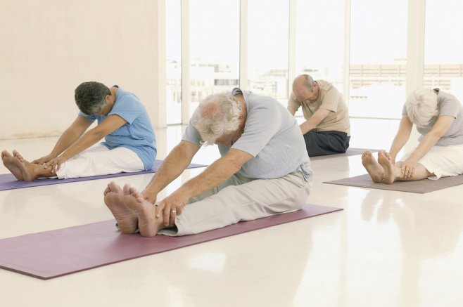 Old people at a yoga class