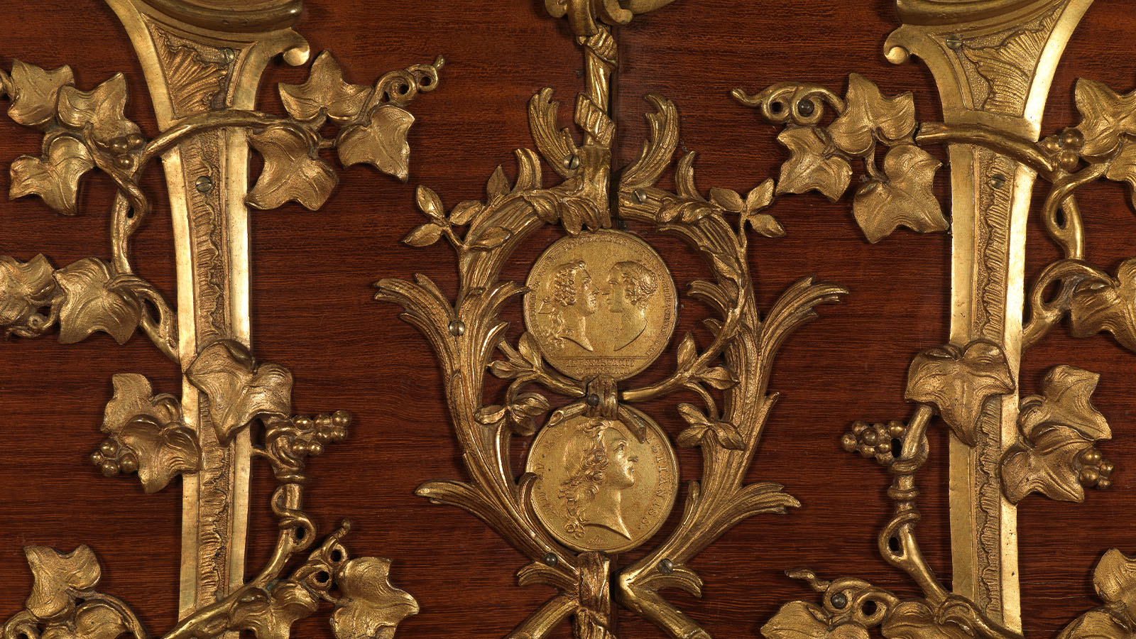 Charles Cressent, Pair of Medal Cabinets (detail). France, c. 1750. Structure in oak veneered with satinwood, amaranth, boxwood, and ebony; chased and gilded bronze. Calouste Gulbenkian Museum, inv. 2368A/B.